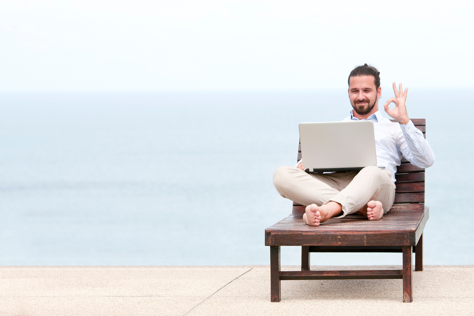 Man Doing Freelance Work During Vacation
